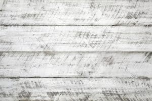 A close-up image of whitewashed timber. This image is a good representation of a whitewashed surface, which can be helpful for users searching for information about whitewash vs. limewash vs. German smear.