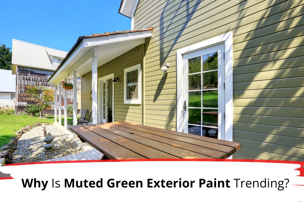 Charming home exterior painted in muted green with white trim, featuring a wooden picnic table on the porch, exemplifying the appeal of muted green exterior paint in residential design.