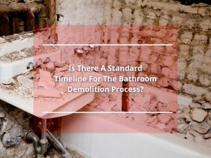 Bathroom demolition process showing heavy debris, broken sink, and partially torn walls with the focus on destruction.