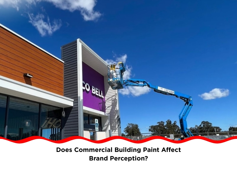 commercial building paint applied on modern retail façade using boom lift