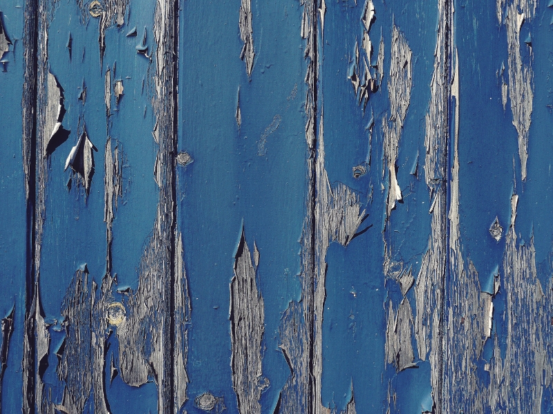 Blue fence painting colours peeling due to harsh Australian sun