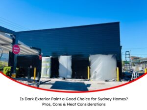 A commercial building exterior painted in dark exterior paint with protective coverings on doors during a sunny day in Sydney.