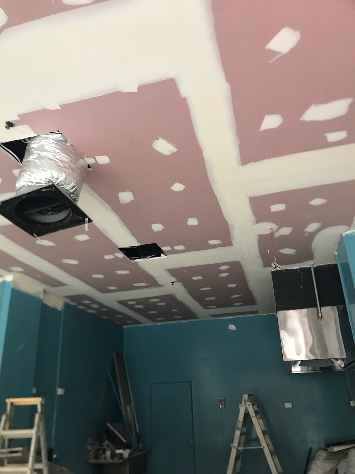 Interior plastering work on ceiling with joint setting and ventilation openings